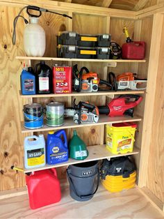 a shelf filled with lots of different types of paint and other things on top of it