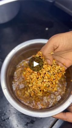 a person is scooping food out of a bowl