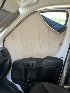 the interior of a small car with its door open