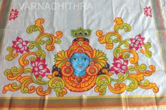 an image of a painting on a cloth with flowers and leaves in the background that reads varnnaaththara