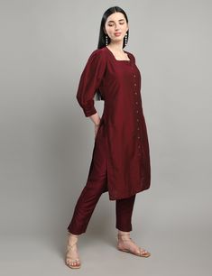 "Dress like royalty with our \"Royal Elegance\" kurta set, crafted from high-quality cotton silk fabric. The deep purple color and solid print give a classic and sophisticated touch to this traditional outfit. The bishop sleeves provide an elegant and flowy look, while the straight cut kurta adds a modern twist to the design. The square neck brings a contemporary edge to the overall look, making it perfect for any occasion, be it formal or casual." Festive Cotton Silk Kurta With Set-in Sleeves, Elegant Designer Cotton Salwar Kameez, Elegant Purple Straight Kurta, Elegant Cotton Sets For Designer Wear, Fitted Kurta With Set-in Sleeves For Festive Occasions, Elegant Purple Chanderi Kurta, Elegant Formal Kurta For Navratri, Elegant Cotton Sets For Diwali, Elegant Purple Cotton Sets