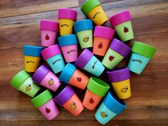 many colorful cups are stacked on top of each other