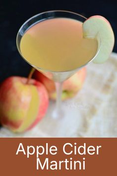 an apple cider martini is garnished with apples