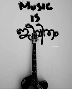 a black and white photo of a guitar with the words music is shop on it