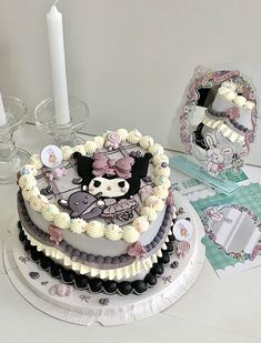 there is a cake that has been decorated with many different things on the top and bottom