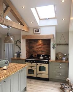 a kitchen with an oven, stove and counter top in it's center area