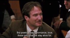 a man sitting at a table with a quote on it that says, but poetry, beauty romance love, these are what we stay alive alive alive for