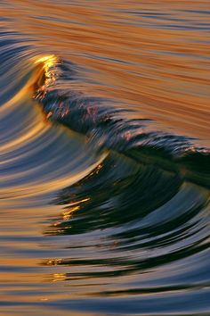 an ocean wave with orange and blue colors