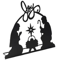 a metal nativity scene with the birth of jesus and baby jesus in silhouette on a white background