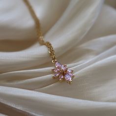 Pink Lotus Necklace, Flower Necklace, Gift for Her, Cubic Zirconia Jewelry, Lotus Necklace, Sparkly Necklace, Christmas Gift, Minimalist ☽ 18K Gold Plated, Pink Cubic Zirconia Charm (19.7x12mm) ☽ This is a gold plated charm meaning that it requires extra care to keep its shine and color intact. Please follow these tips to make the charm last longer in its original condition: avoid wearing it to the beach, pool, shower, bathtub, hot tub; avoid it touching any lotions, creams, or sweat; take it of Pink Flower Necklace, Shower Bathtub, Dainty Choker Necklace, Pool Shower, Sparkly Necklace, Lotus Necklace, Pink Lotus, Necklace Flower, Cubic Zirconia Jewelry