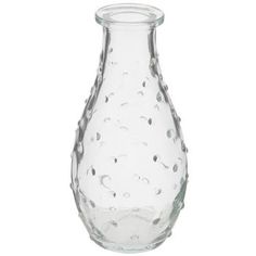 a clear glass vase with water droplets on the bottom and sides, set against a white background