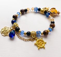 Genshin Auswirkungen Navia Charakter Themen Elastische Armband mit Metall Geo Vision Charme, Tigerauge, Schwarzer Achat Mit Gold Aufkleber, Kristallperlen, Glasperlen und blauer Tropfen, Edelstahl Bogen und Blume, und vergoldete Legierung Rad Perle. Kaufen Sie dies als Geschenk für Ihre spezielle Person? Oder vielleicht möchten Sie eine Box, um Ihren Einkauf sicher aufzubewahren? Achten Sie darauf, unsere kundenspezifische Verpackung mit Ihrer Bestellung zu überprüfen-perfekt für Geschenke und Lagerung ~! https://www.etsy.com/uk/listing/1836187341/upgraded-gift-wrap-and-packaging-for-any?ref=listings_manager_grid Alle Perlen und Anhänger werden sorgfältig ausgewählt, um das Farbschema, die Hobbys und Interessen jedes einzelnen Charakters widerzuspiegeln, und jedes Armband wird auf Bestellu Geo Vision, Hydro Vision, Jewelry Bracelets, Beaded Bracelets, Bracelet, Anime, Gold, Quick Saves, Kawaii