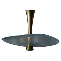 a large metal object with a gold base