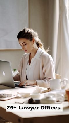 a woman sitting in front of a laptop computer on top of a wooden table next to a cup of coffee