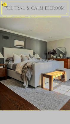 a bed sitting in the middle of a living room next to a dresser and mirror