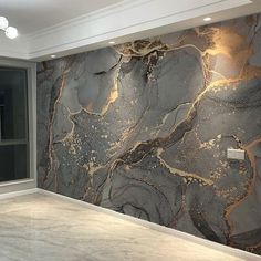 a large marble wall in an empty room