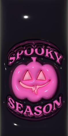 the spooky season sign is pink and black