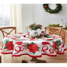 a christmas table cloth with poinsettis on it