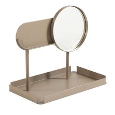 a small mirror on a metal stand with a white back ground and light brown sides