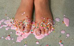 a person's feet with sprinkles on them