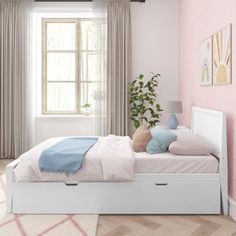 a bedroom with pink walls and white furniture