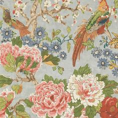 a blue floral wallpaper with birds and flowers