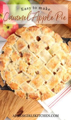 an apple pie sitting on top of a wooden cutting board