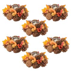 four ceramic turkeys and pine cones are arranged in the shape of three heads on top of each other