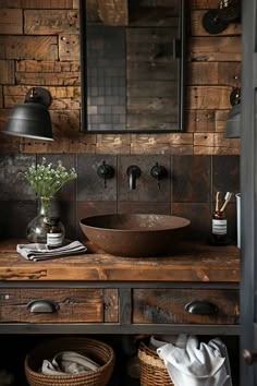 a bathroom sink sitting on top of a wooden counter next to a basket filled with flowers