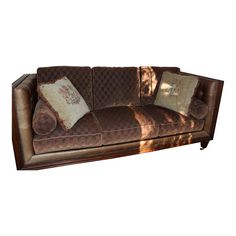 a brown couch with two pillows on it