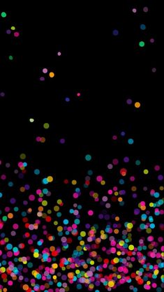 multicolored confetti on black background with space for text