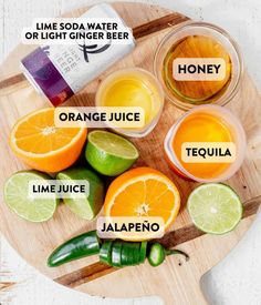 orange juice, lime juice and jalapeno on a cutting board with labeled ingredients