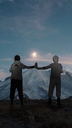 two people holding hands on top of a mountain under a moon lit sky with mountains in the background