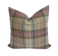 a plaid pillow on a white background