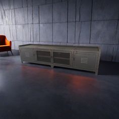 an orange chair sitting next to a large metal cabinet in a room with concrete walls