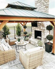 an outdoor living area with wicker furniture