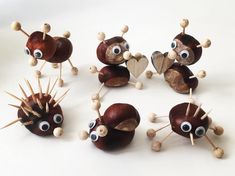 the toy animals are made out of wood and have googly eyes