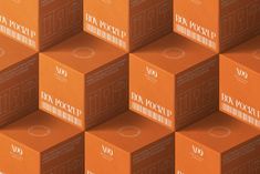 many orange boxes are stacked on top of each other with barcodes printed on them