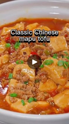 the video shows how to make classic chinese mapu tofu with meat and vegetables