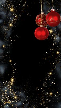 two red christmas ornaments hanging from strings against a black background with gold stars and snow flakes