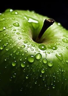 an apple with water drops on it