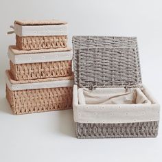 wicker baskets stacked on top of each other with linen linings in the bottom