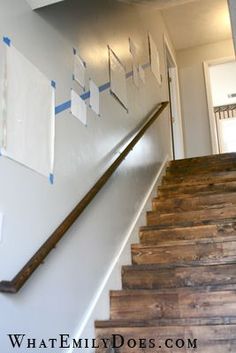 an image of a staircase with pictures hanging on the wall and below it is a photo of a stair case