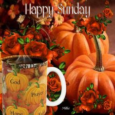 a coffee mug with roses and pumpkins on it next to a happy sunday card