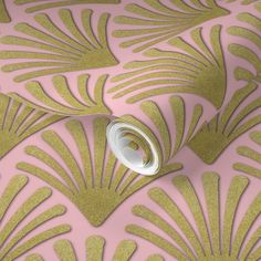 a pink and gold wallpaper with an intricate design on it's sidewall