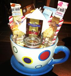 a coffee cup filled with candy and snacks