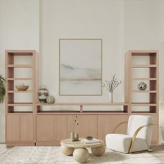 a living room filled with furniture and a large painting on the wall above it's bookshelf