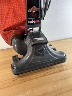 a close up of a person's legs with a vacuum on top of it