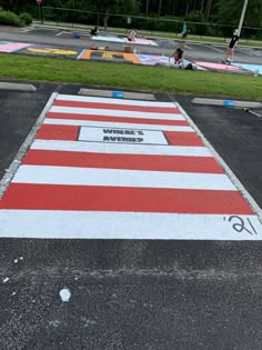 an empty parking lot painted in red, white and blue