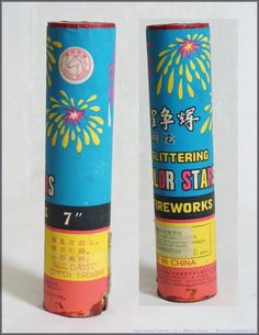 two rolled up fireworksticks sitting next to each other